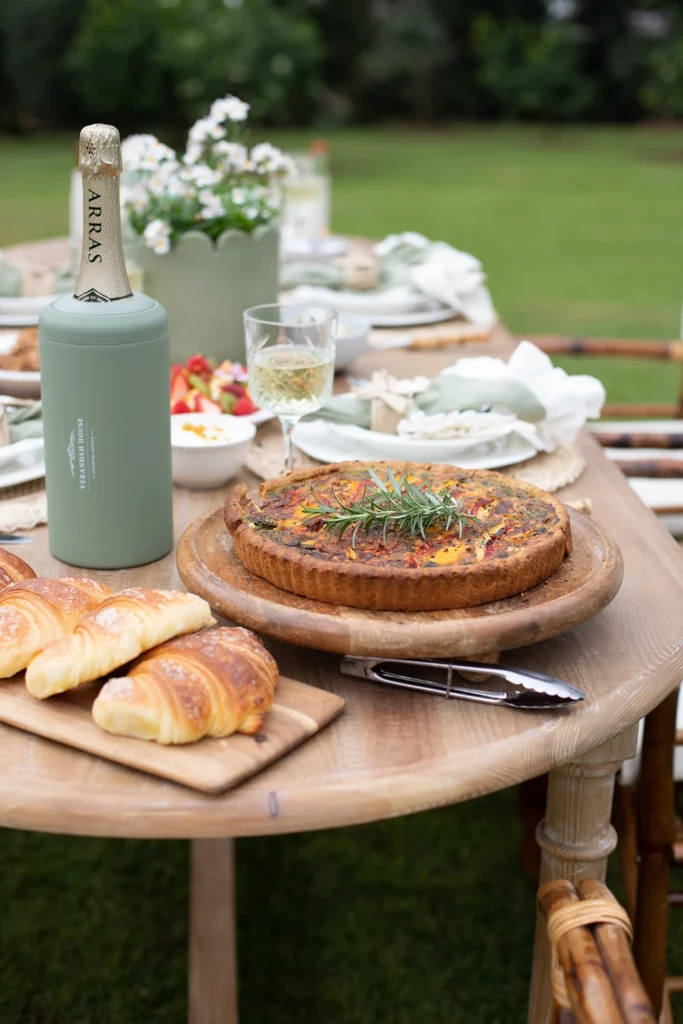 Gourmet picnic spread with sourdough, cheese and fresh juice ready for lunch