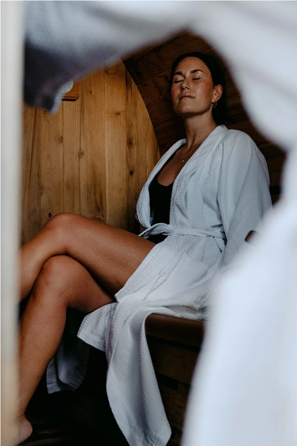 Guest relaxing in the cedar sauna at VH Country Estate